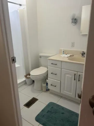 a bathroom with a sink toilet and vanity
