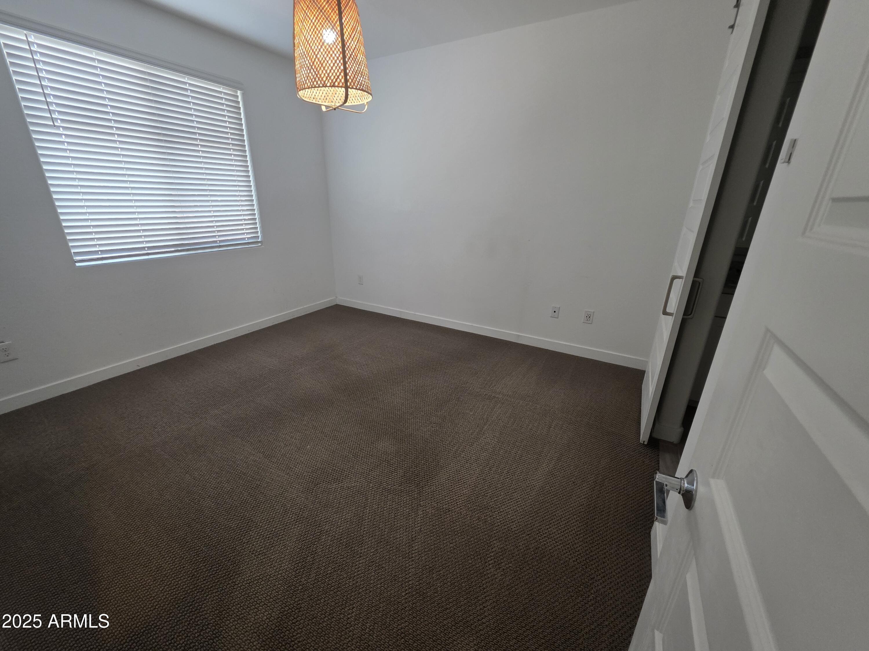 4100 South Pinelake Way, Unit 142 Chandler, AZ 85249 - Photo 14 of 25 an empty room with a window