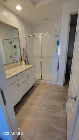 a room with a mirror and a sink