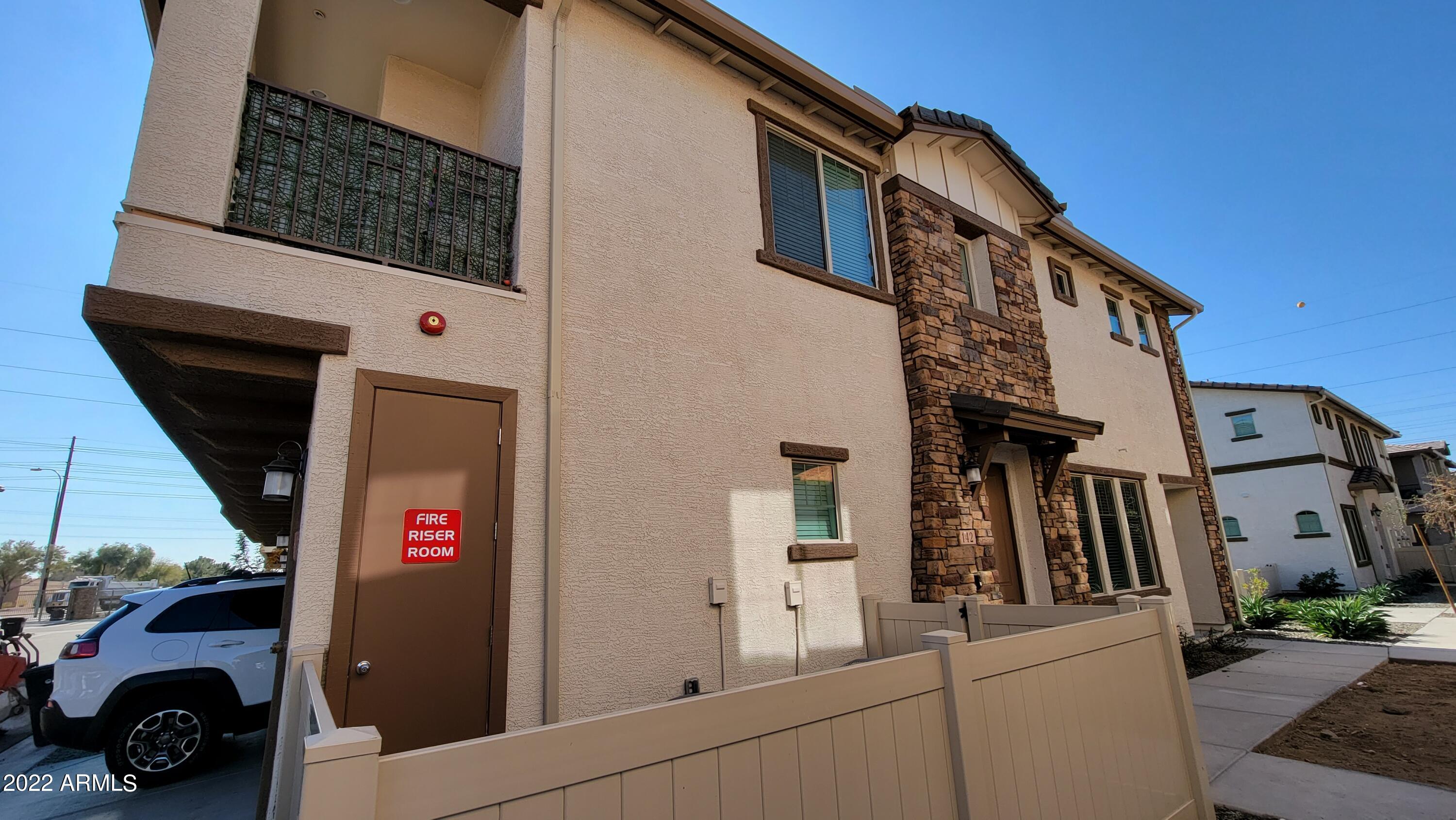 4100 South Pinelake Way, Unit 142 Chandler, AZ 85249 - Photo 2 of 25 a front view of a building with parking space