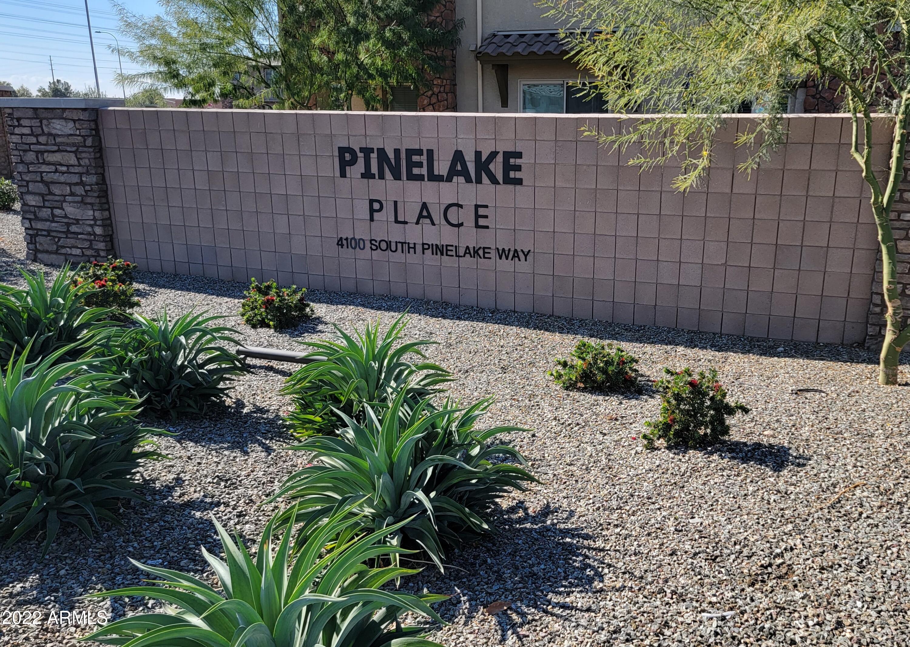 4100 South Pinelake Way, Unit 142 Chandler, AZ 85249 - Photo 25 of 25 a sign on the side of a building