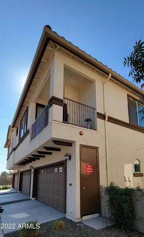 a front view of a house with a garage