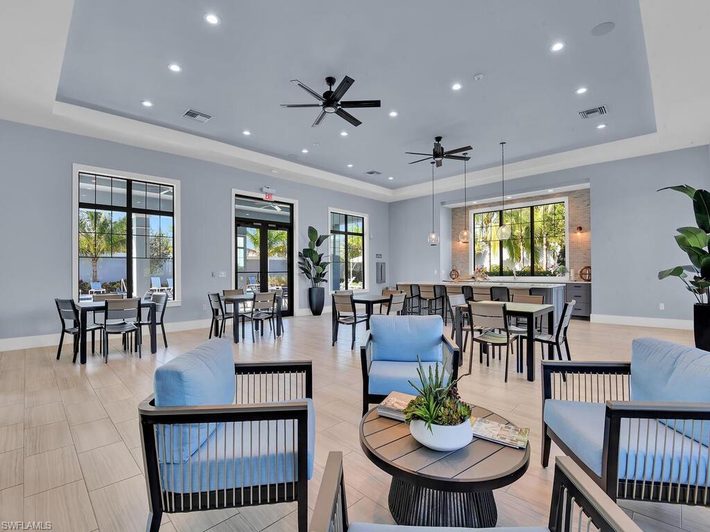 2561 Seychelles Drive, Unit 308 Naples, FL 34112 - Photo 23 of 28 a view of a dining room with furniture window and outside view