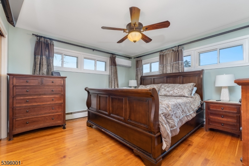 417 Mountain Road Lebanon, NJ 08833 - Photo 17 of 40 a bedroom with a bed and a chandelier