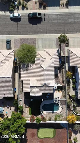 a house with lots of trees in front of it