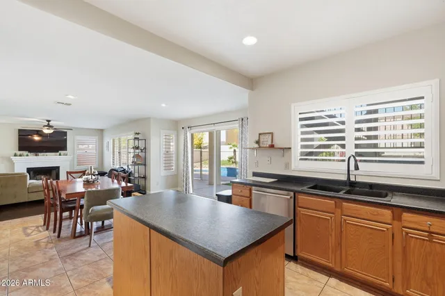 a kitchen with lots of counter top space and dining table