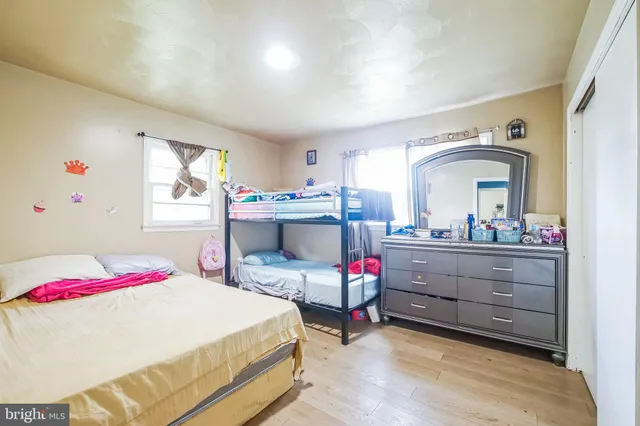 a bed room with a bed and a chair