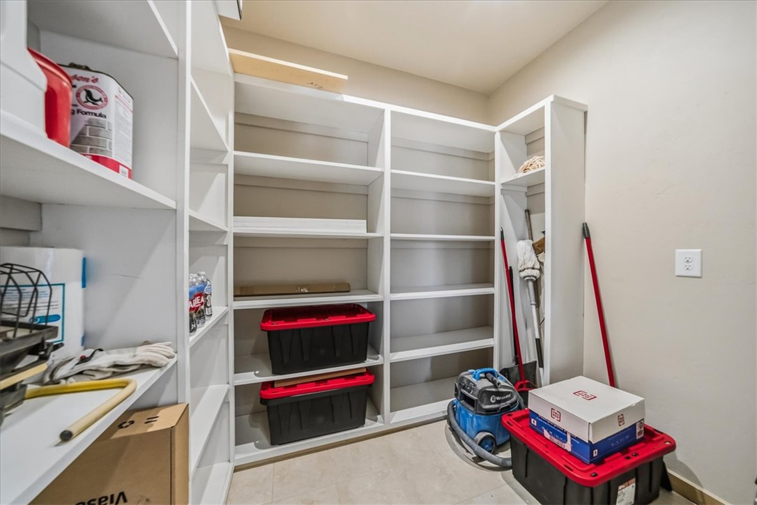 10374 East Happy Trails Road Kingman, AZ 86401 - Photo 22 of 68 a view of walk in closet with clothes and shoes