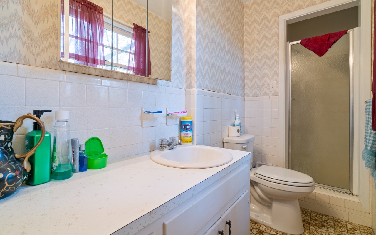 3805 Hilldale Road Oakwood, GA 30566 - Photo 12 of 28 a bathroom with a sink and a toilet