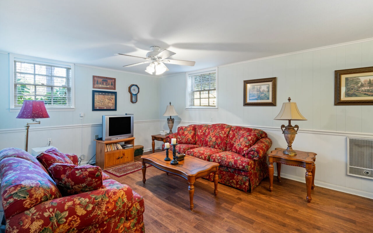 3805 Hilldale Road Oakwood, GA 30566 - Photo 18 of 28 a living room with furniture and a flat screen tv