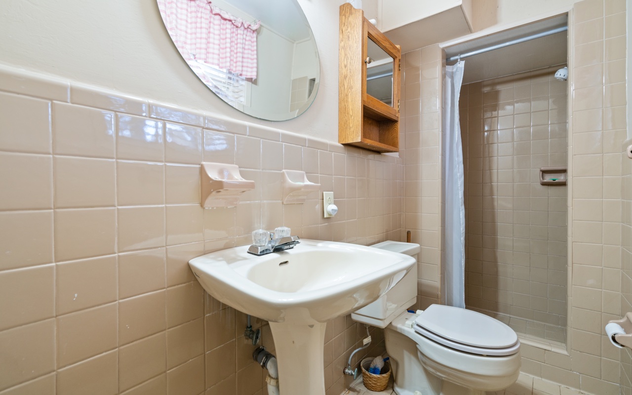 3805 Hilldale Road Oakwood, GA 30566 - Photo 19 of 28 a bathroom with a sink a toilet and mirror