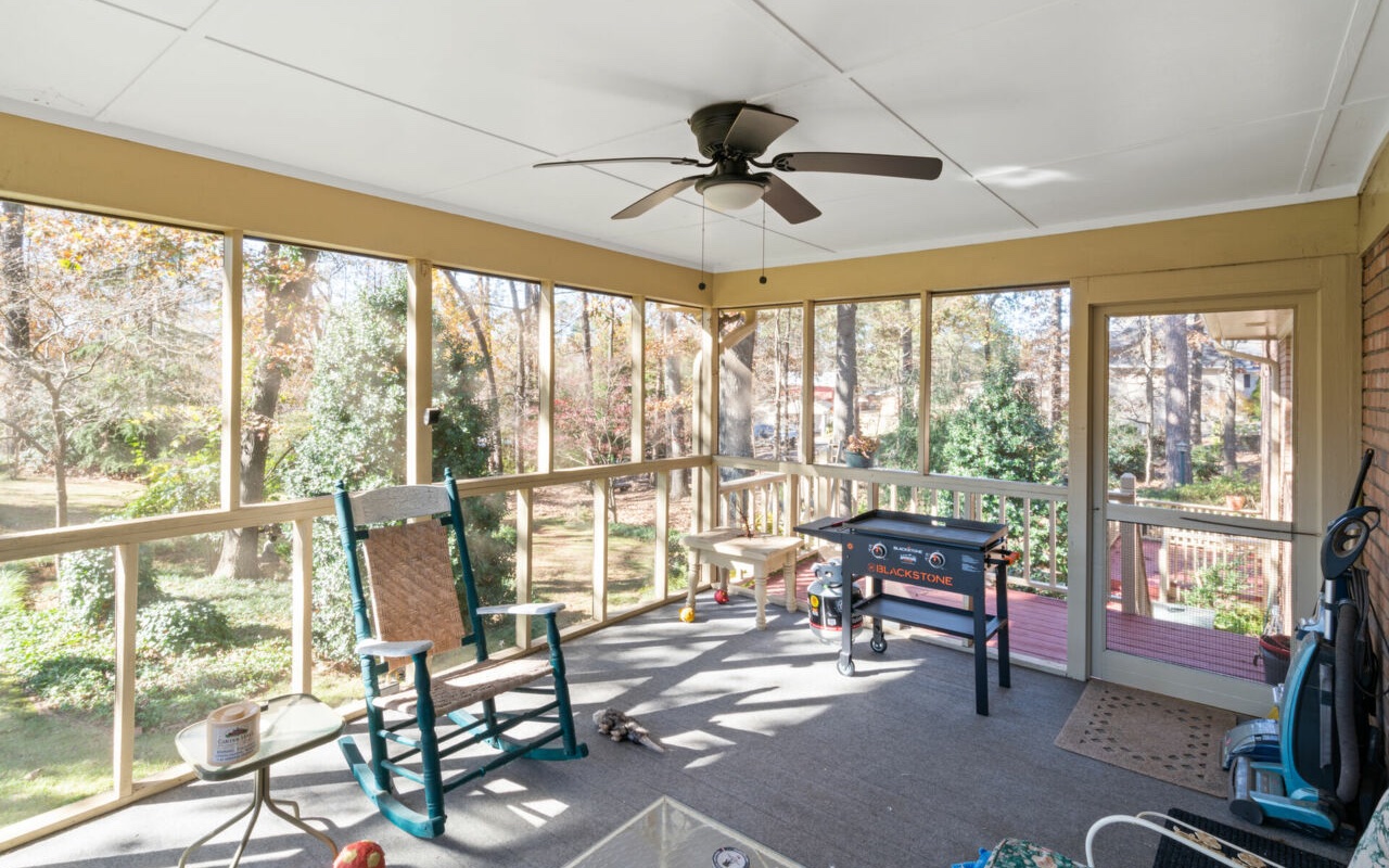 3805 Hilldale Road Oakwood, GA 30566 - Photo 20 of 28 a living room with furniture and floor to ceiling windows