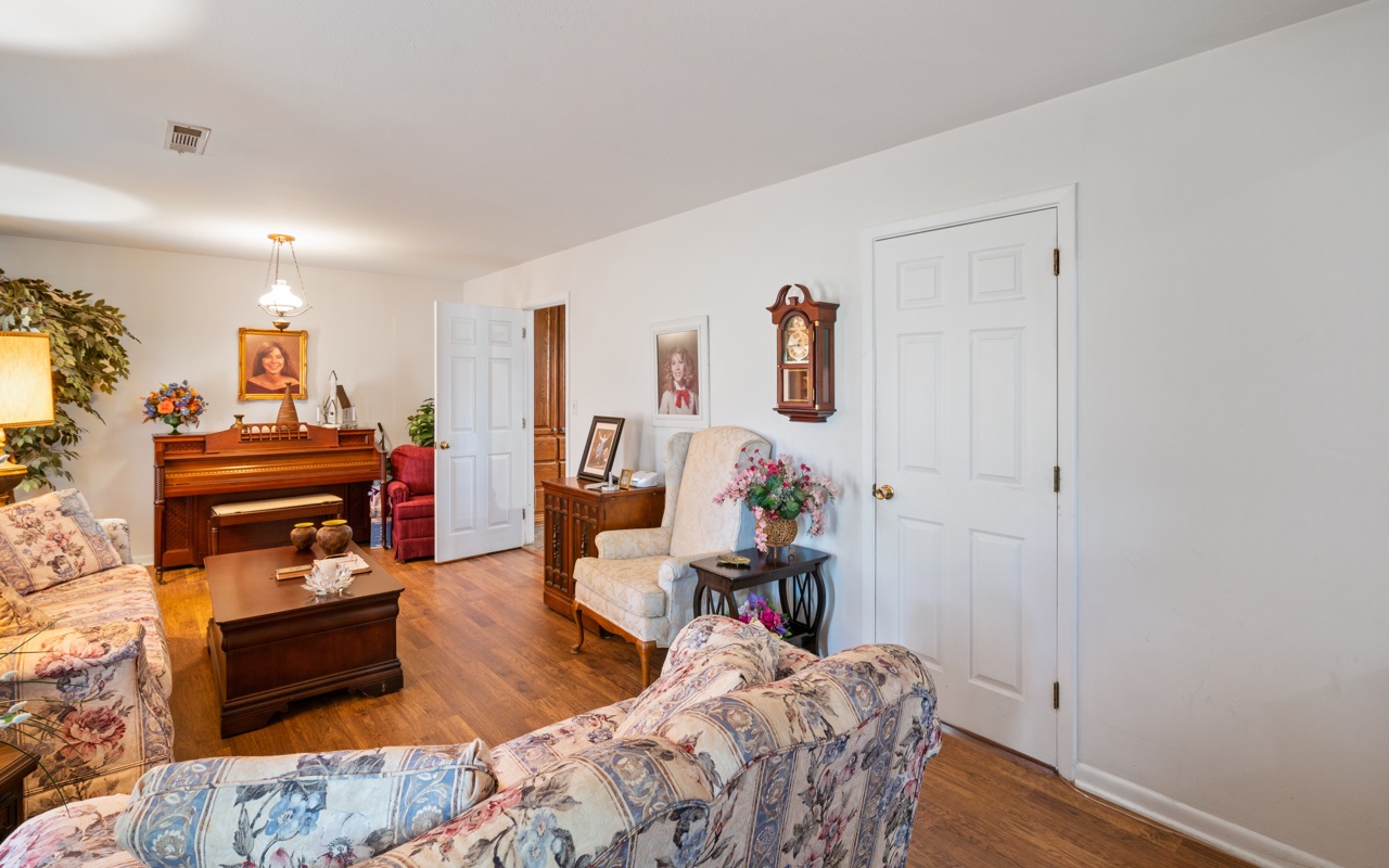 3805 Hilldale Road Oakwood, GA 30566 - Photo 2 of 28 a bedroom with furniture and a wooden floor