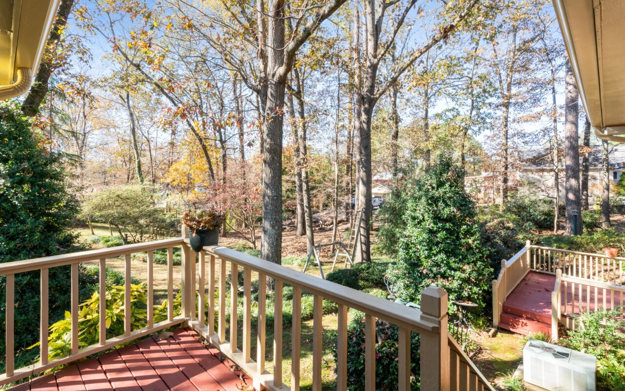3805 Hilldale Road Oakwood, GA 30566 - Photo 22 of 28 a view of a balcony with wooden chairs and floor and wooden fence