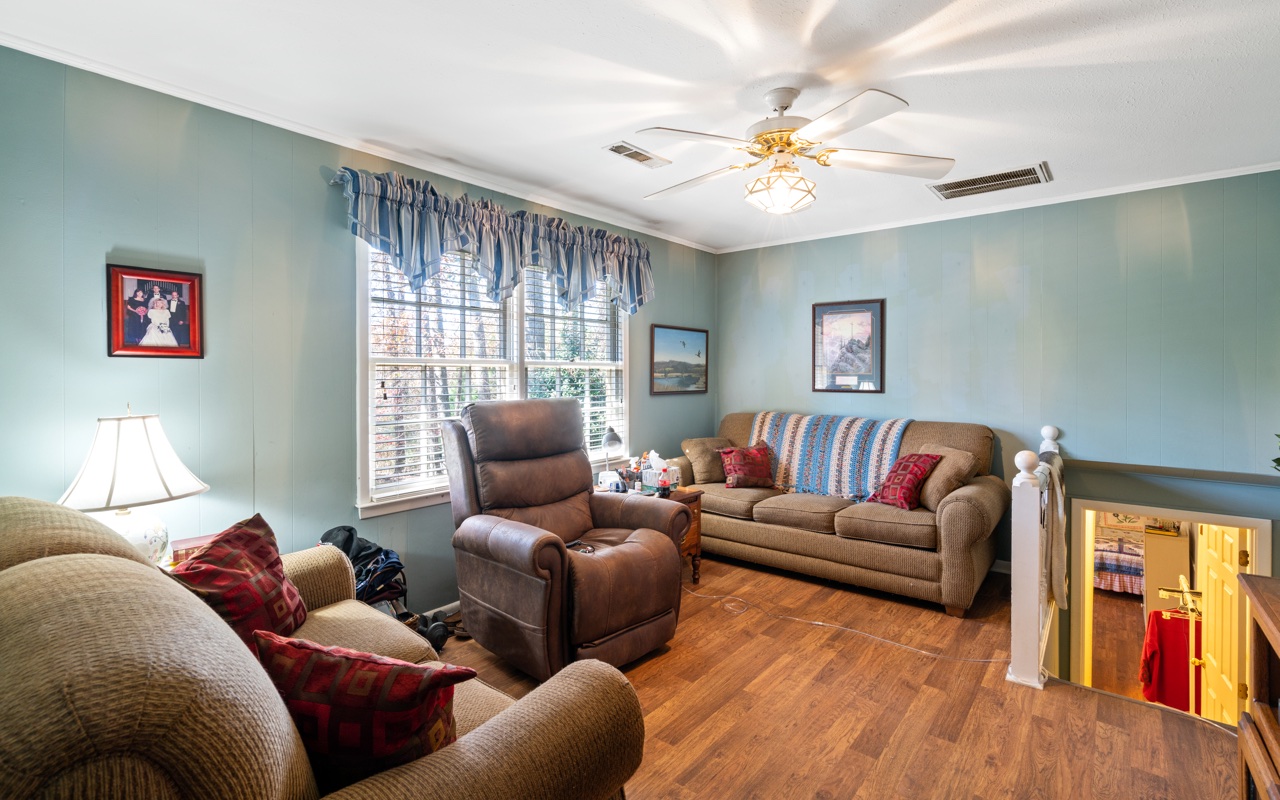3805 Hilldale Road Oakwood, GA 30566 - Photo 8 of 28 a living room with furniture and a large window