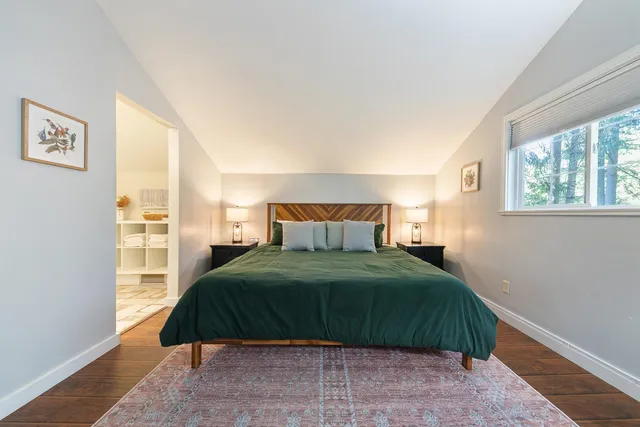 a bedroom with a bed and window