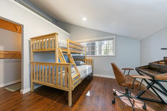 a bedroom with furniture and a window