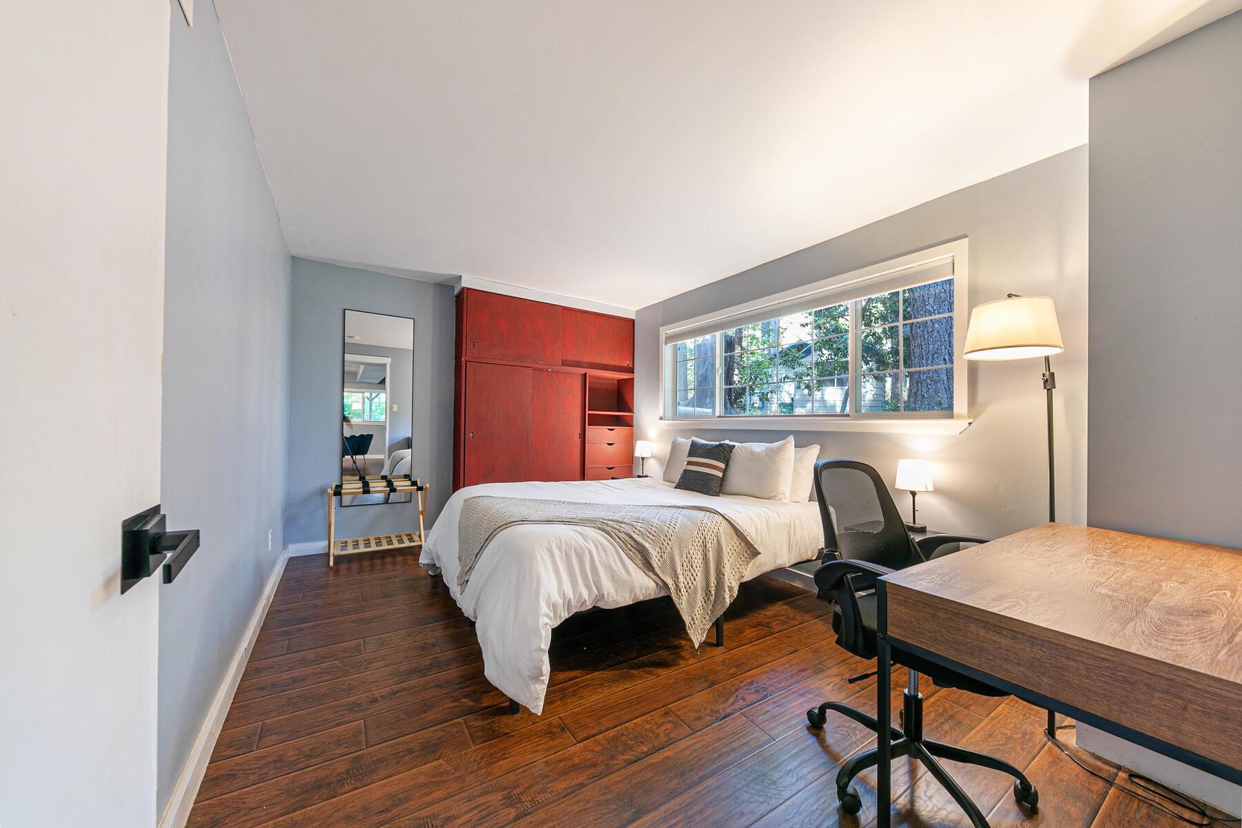16844 Pasquale Road Nevada City, CA 95959 - Photo 18 of 27 a bedroom with a bed and wooden floor