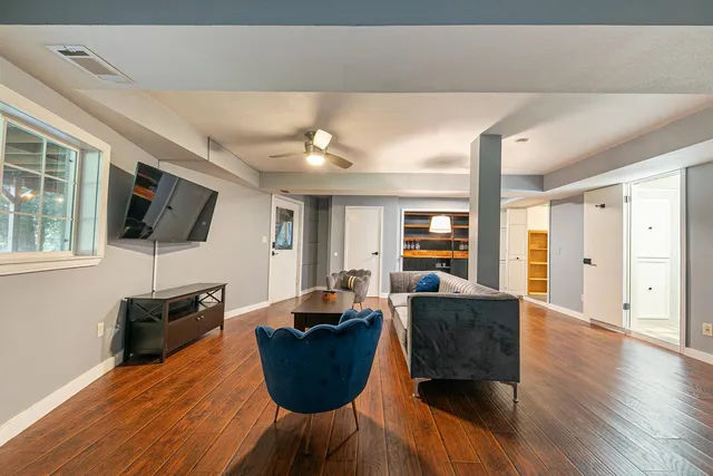 a living room with furniture fireplace and a flat screen tv