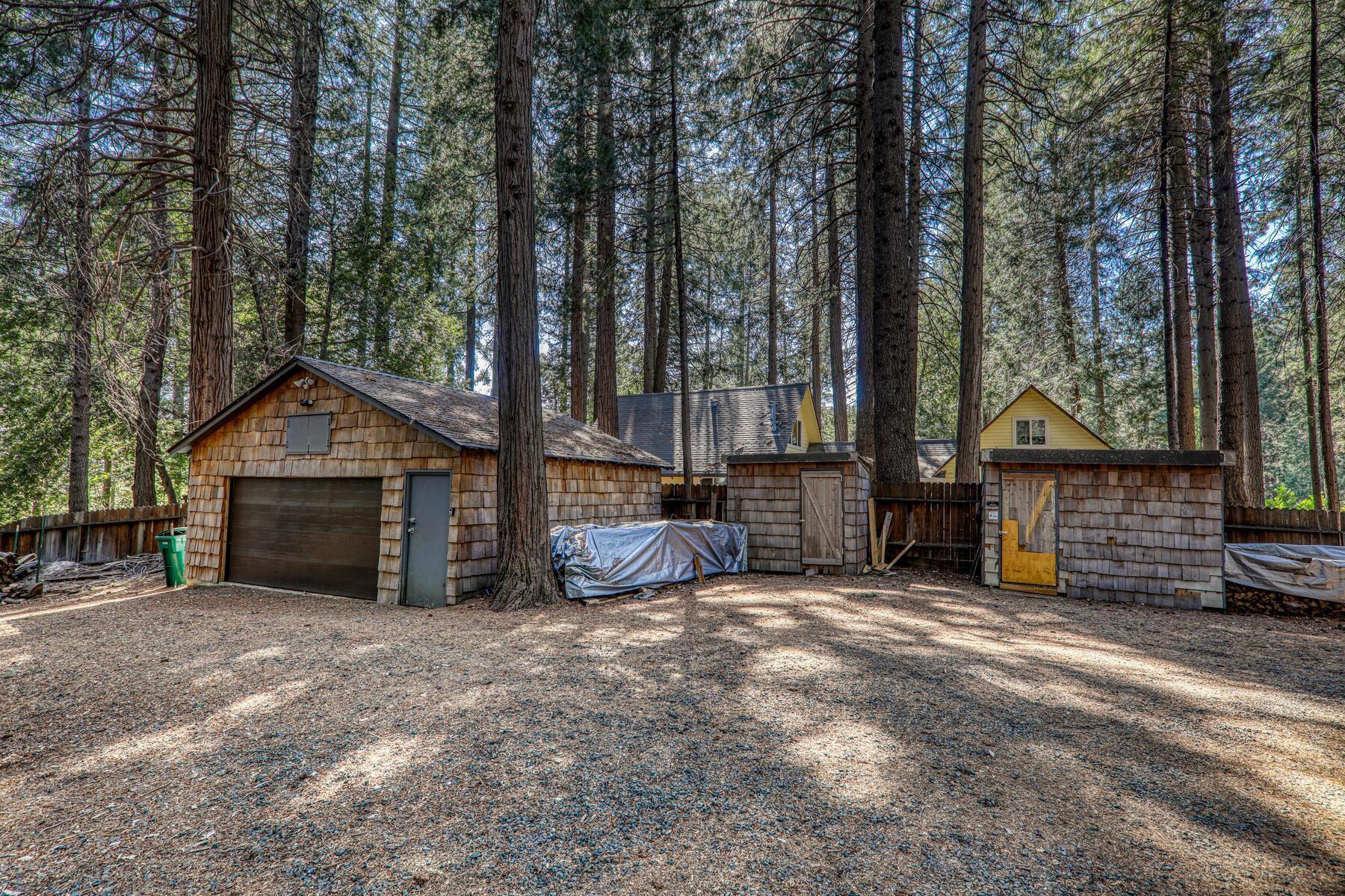 16844 Pasquale Road Nevada City, CA 95959 - Photo 6 of 27 a view of a house with a yard and wooden fence