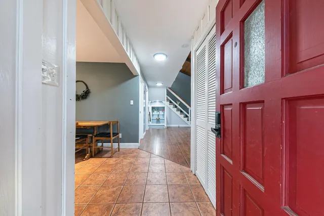 a view of entryway and hall with a front door
