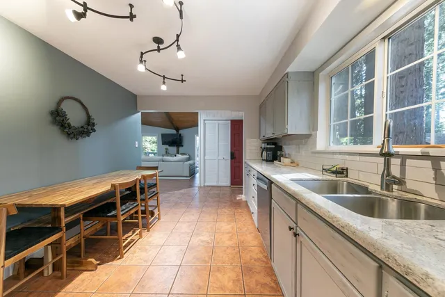 a kitchen with a sink and cabinets