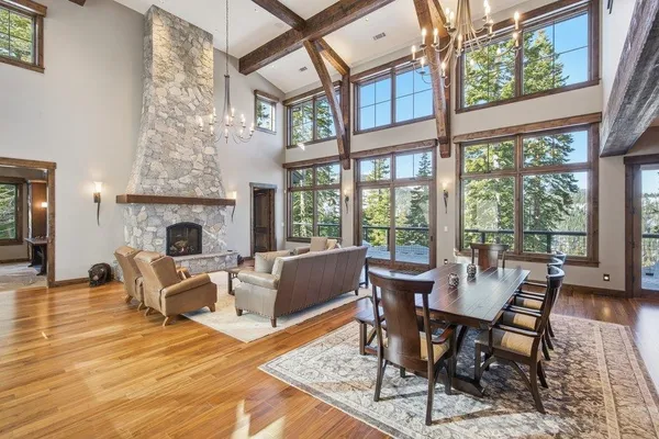 a view of a livingroom with furniture window and wooden floor
