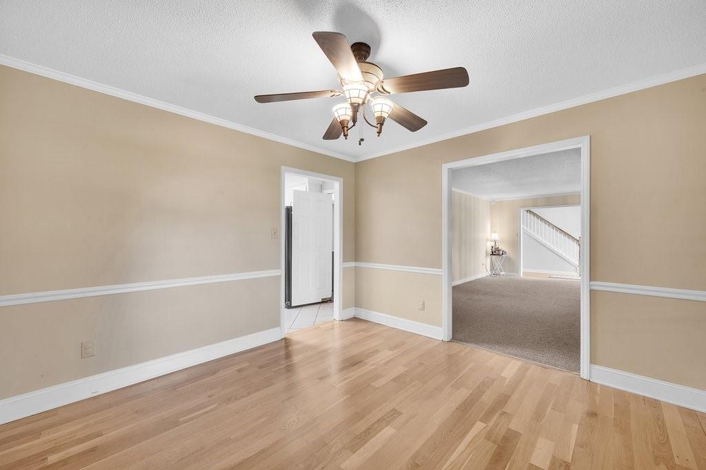 4655 Lake Shore Road North Denver, NC 28037 - Photo 11 of 31 an empty room with wooden floor fan and windows