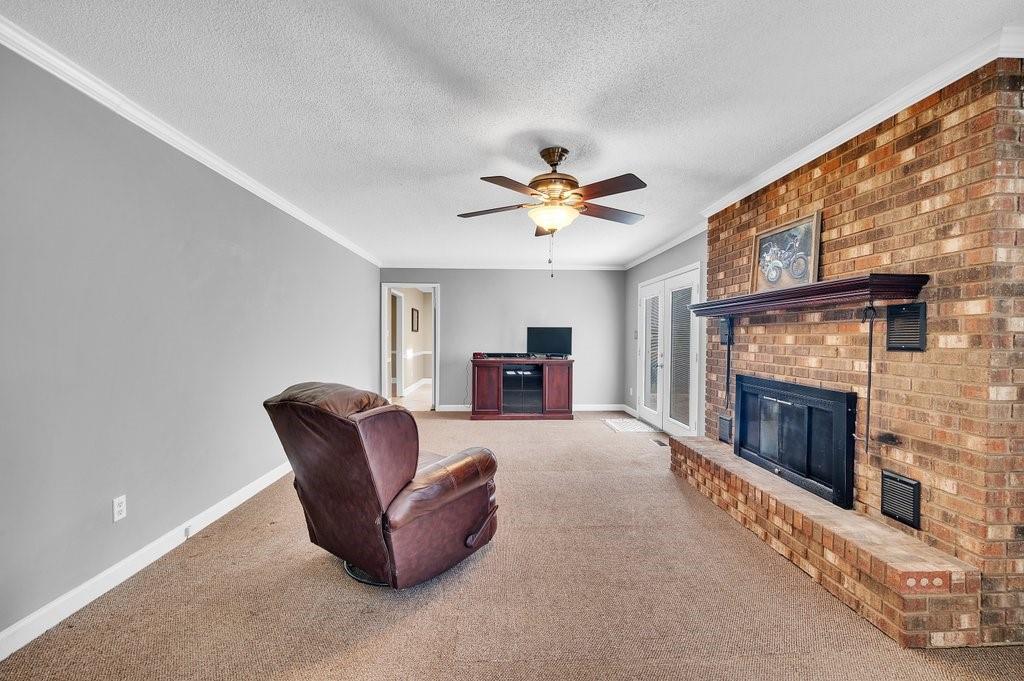 4655 Lake Shore Road North Denver, NC 28037 - Photo 15 of 31 a living room with furniture and a fireplace