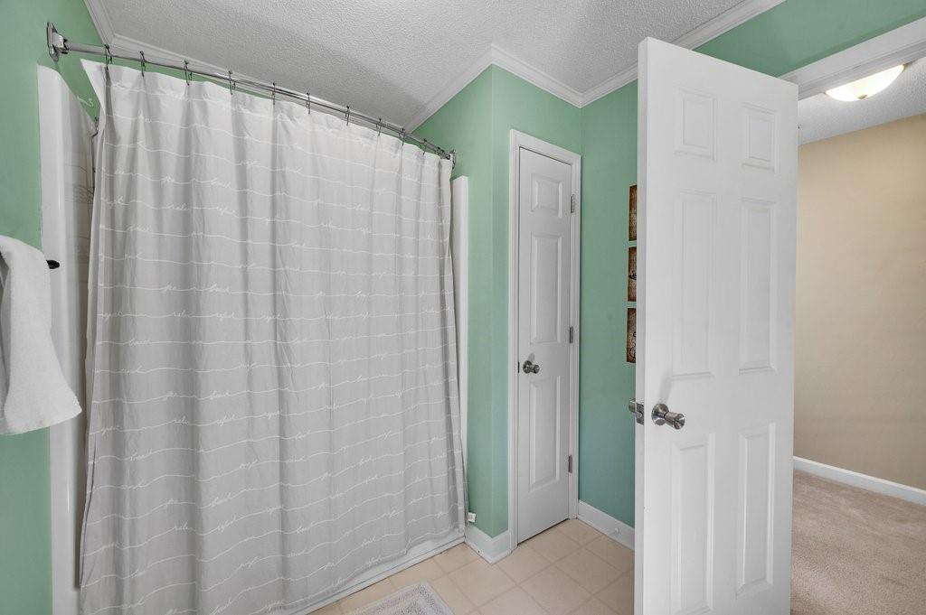 4655 Lake Shore Road North Denver, NC 28037 - Photo 22 of 31 a view of a bathroom with shower curtain