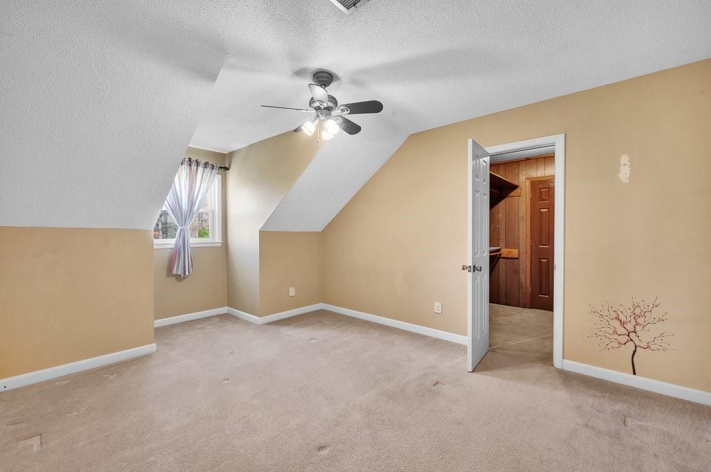 4655 Lake Shore Road North Denver, NC 28037 - Photo 27 of 31 a view of an empty room with a ceiling fan