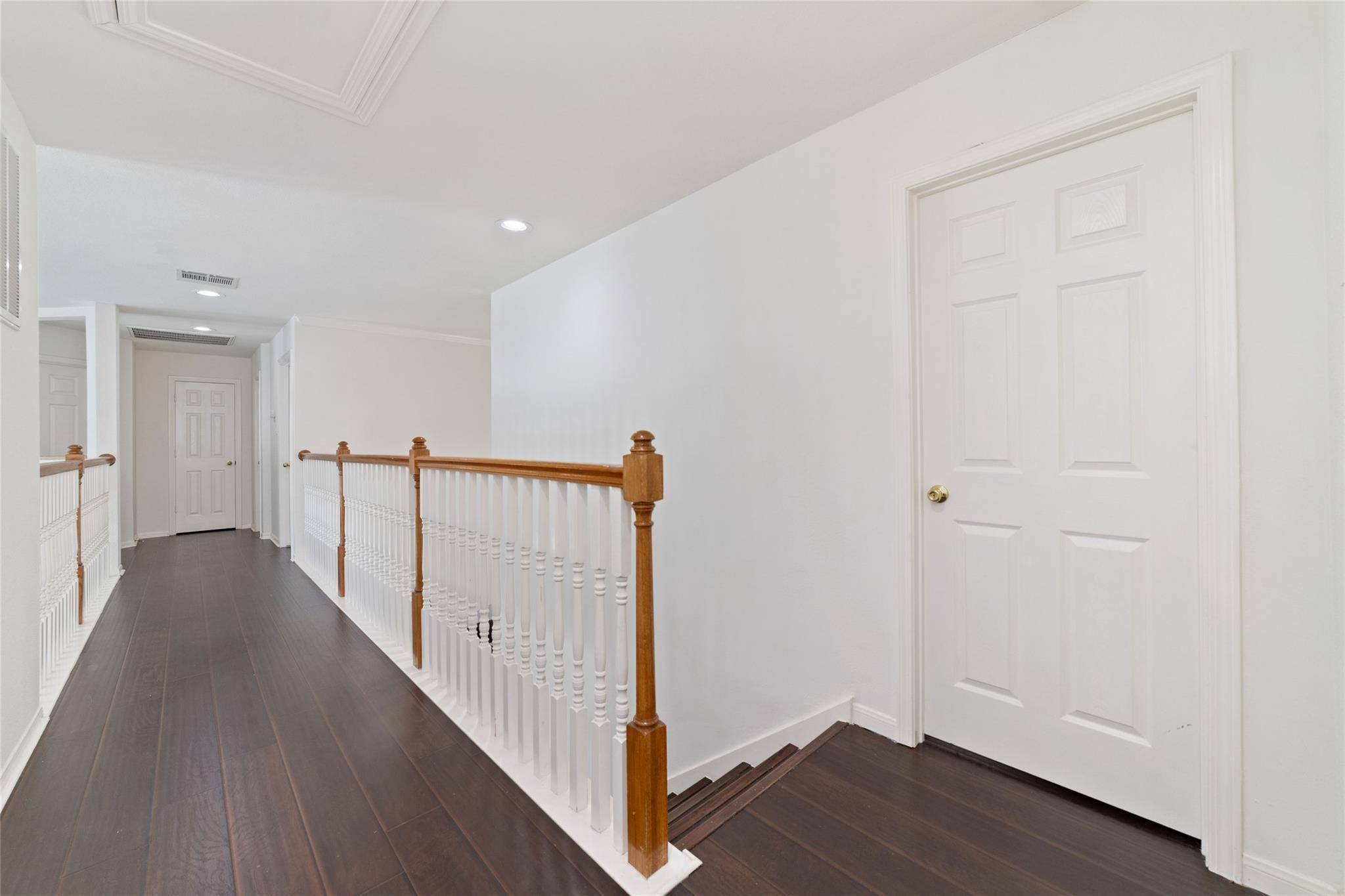 22406 Piper Terrace Lane Katy, TX 77450 - Photo 34 of 44 a view of a hallway with wooden floor and entryway
