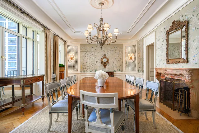 a bedroom with furniture and a large window