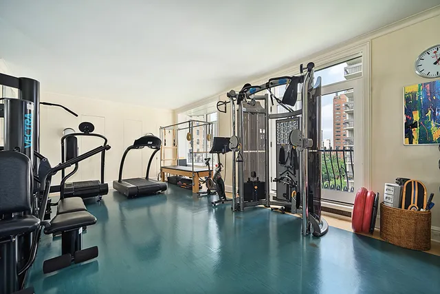 a bathroom with a granite countertop sink a mirror and a bathtub next to a window