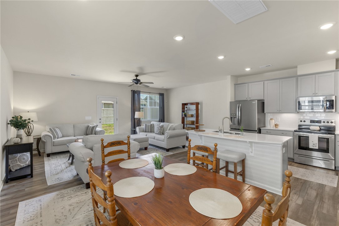 432 Bee Cv Way Pendleton, SC 29670 - Photo 9 of 39 This bright open-concept living space features a functional kitchen and inviting dining area.