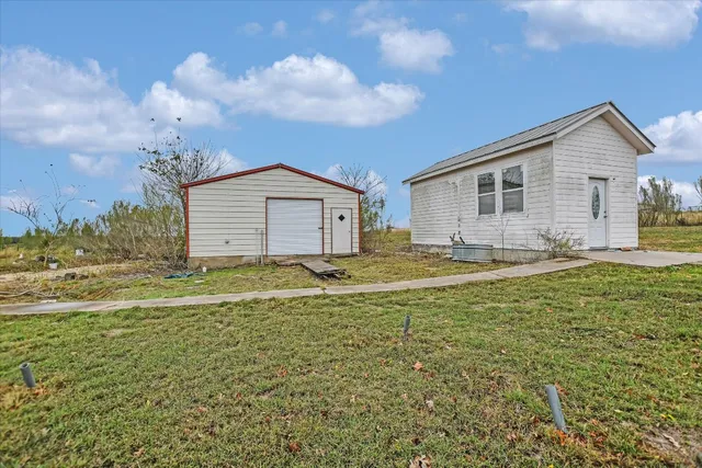 a house view with a garden space