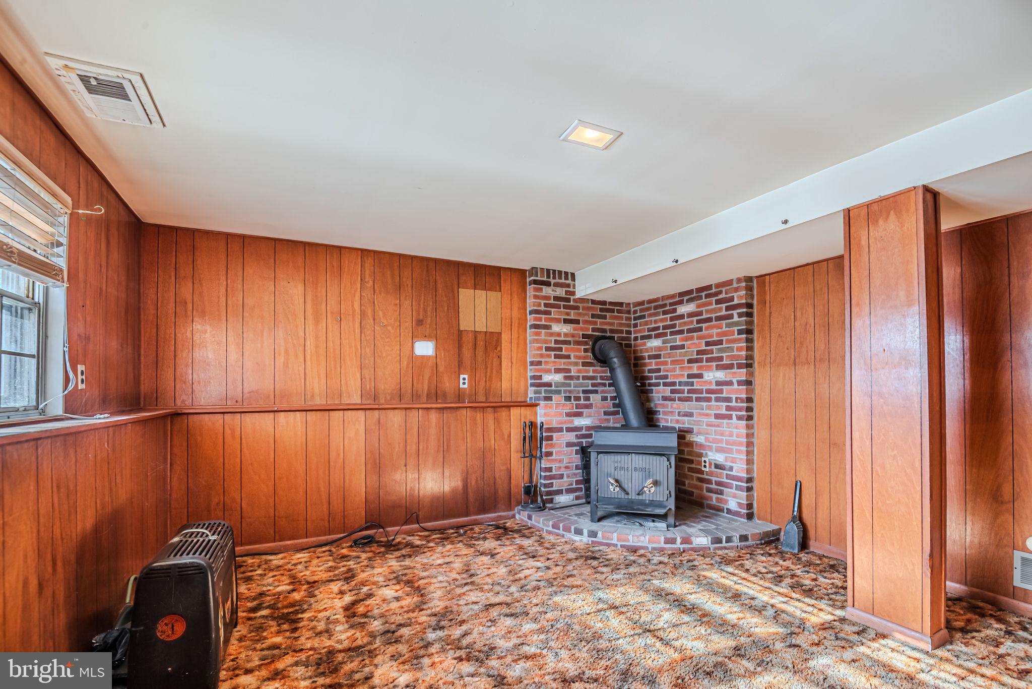 12 Alwyn Road Newark, DE 19713 - Photo 30 of 43 Lower level family room with wood stove