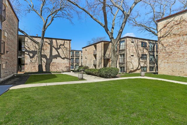 a view of a street with a building in the background