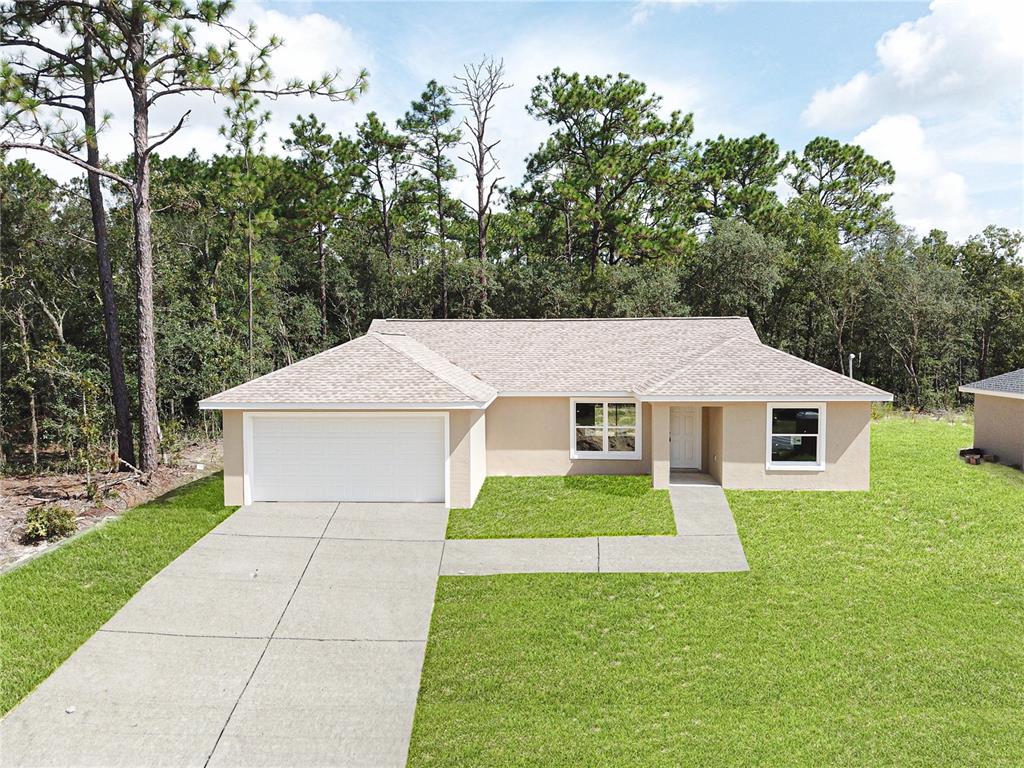 790 West Homeway Loop Citrus Springs, FL 34434 - Photo 1 of 1 Driveway and grass are virtually edited - driveway will be poured after construction is completed and sod.