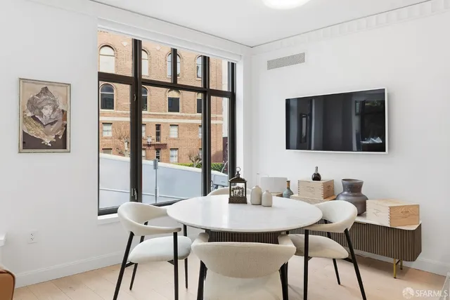 a dining room with furniture and window