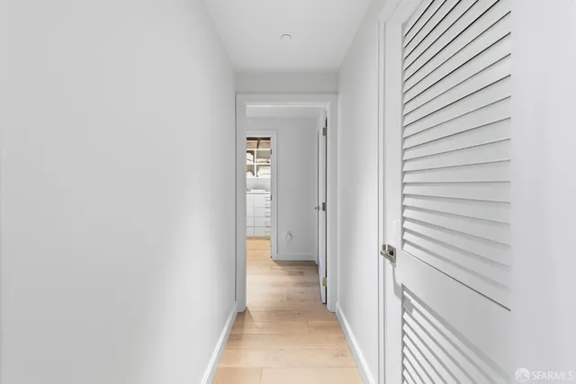 a view of a hallway with a white walls