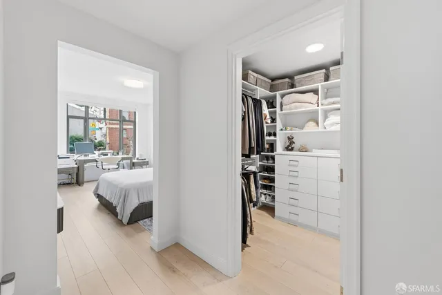 a bedroom with furniture and closet