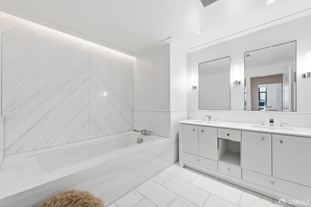 a bathroom with a bathtub and shower
