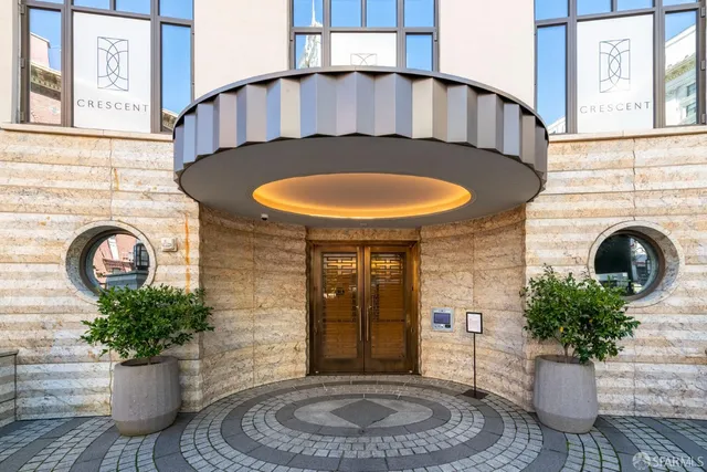 a view of a room with furniture and wooden floor