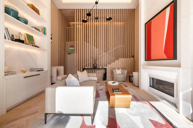 a view of a living room and a balcony