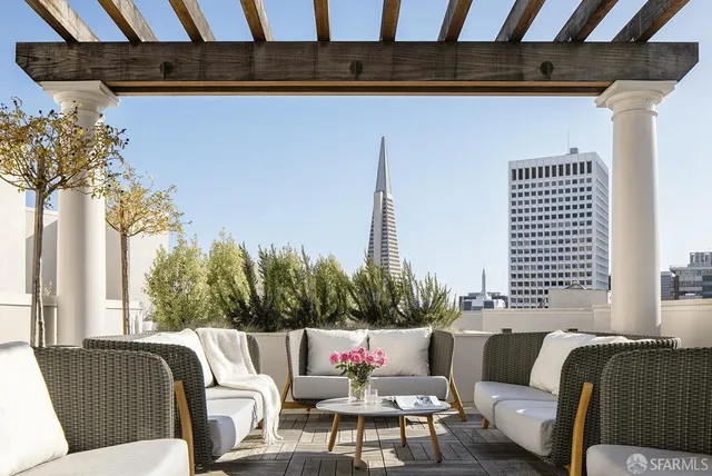 a view of a terrace with furniture and stove