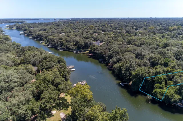 an aerial view of a houses with ocean view