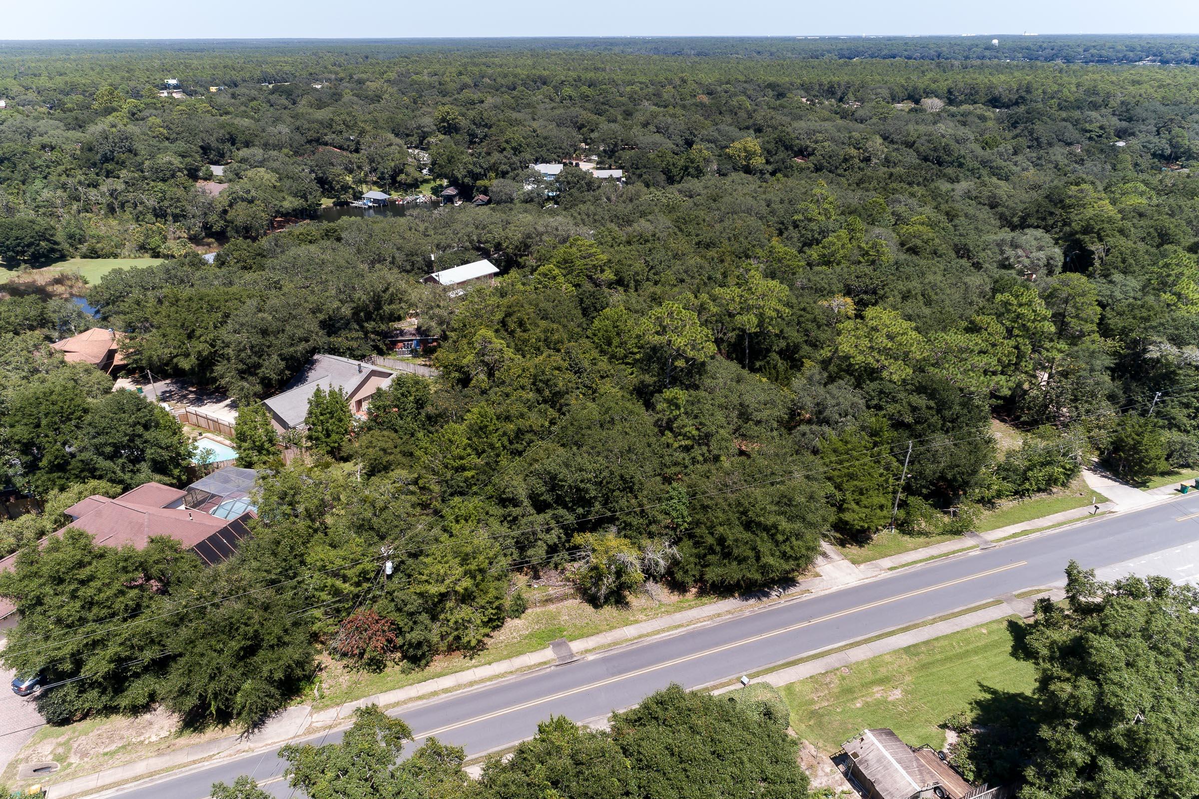 Xx Northwest Xx Nw Mooney Road Fort Walton Beach, FL 32547 - Photo 6 of 26 an aerial view of a house with a yard