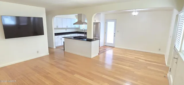 a kitchen with granite countertop a stove and a refrigerator