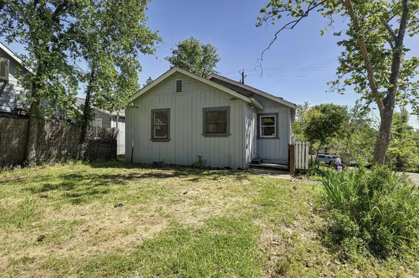 a house with trees in front of it